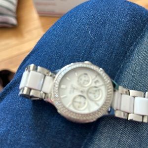 DKNY WATCH. White and Chrome. Has 3 circles from other  time zones. Used.